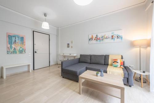 a living room with a couch and a table at Kallithea metro station in Athens