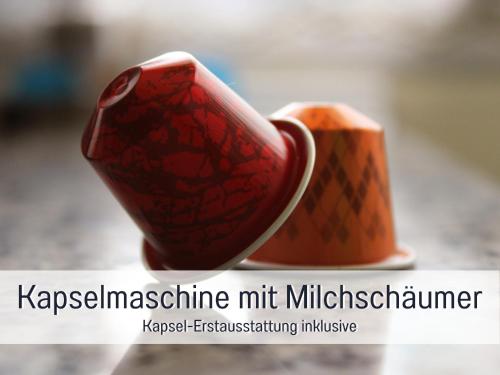 two red cups sitting next to each other at Chalet am Oberhausberg, Region Schladming Dachstein in Haus im Ennstal