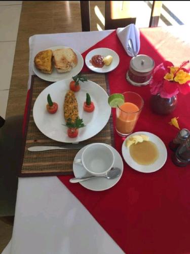 a table topped with plates of food on a table at Private Room and Tours in Lalībela
