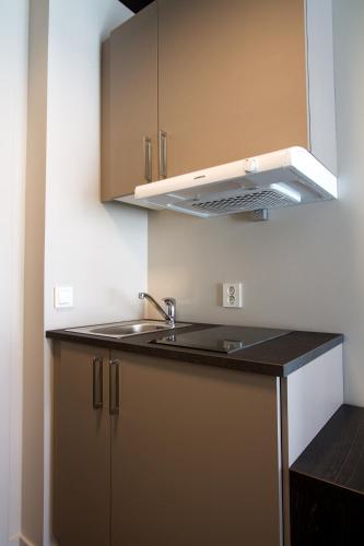 a kitchen with a sink and a stove at Wilhelmsen House in Tønsberg