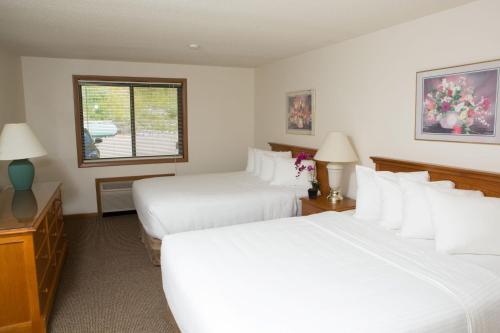 Postel nebo postele na pokoji v ubytování NASWA Resort