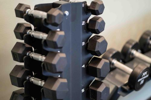 a bunch of dumbbells stacked on top of each other at Injoy Premium Hotel Solna in Solna