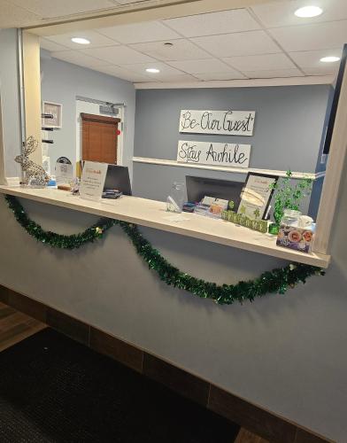 an office counter with a christmas wreath on it at Sonesta Simply Suites Nanuet in Nanuet