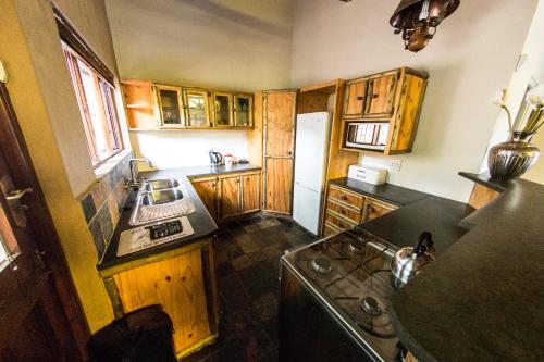 an overhead view of a kitchen with wooden cabinets at Fish Eagle Manor in East London