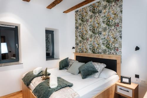 Postel nebo postele na pokoji v ubytování Apartmaji Vouk - sodobni apartmaji v objemu narave - Lukanja - Rogla - Primerno za pare in družine - Sprostitev in aktivno preživljanje prostega časa