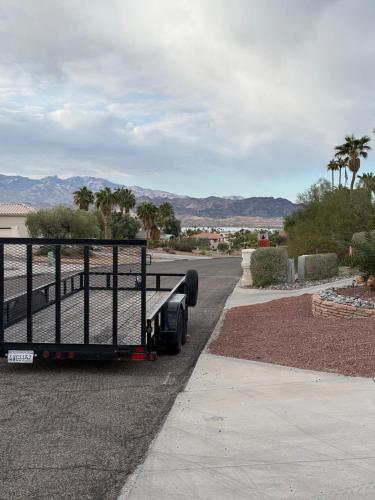a semi truck parked on the side of a road at Grand Havasu Oasis with Custom Pool & Spa! in Lake Havasu City
