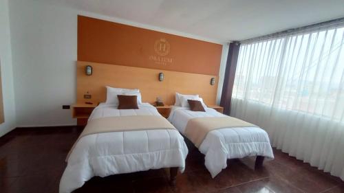 Ένα ή περισσότερα κρεβάτια σε δωμάτιο στο Hotel inka luxe casa rams
