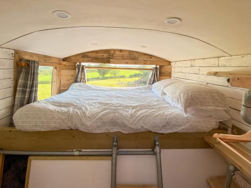 a bed in the inside of a tiny house at Vincent in Ballybogy