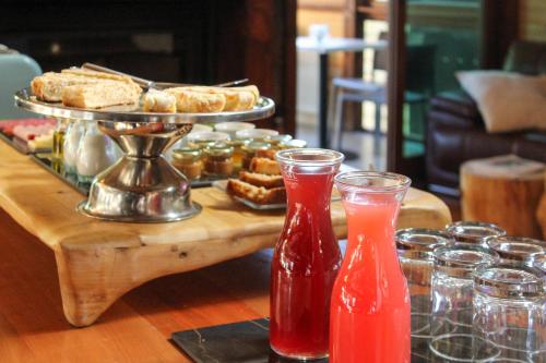 a table with a tray of food and drinks at NI-NEWEN Hotel & Lodge in Pucón
