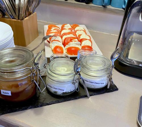 a counter with jars of honey and peeled oranges at Townside Hostel Bremen in Bremen