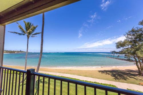 a view of the beach from a balcony at Pono Kai A306 in Kapaa