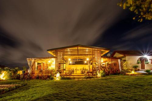 a house lit up at night with lights at Sealine View Hospitality Centre in Oblogo