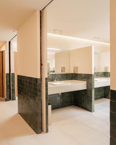 a bathroom with a sink and a mirror at Camping Santa Elena in Lloret de Mar