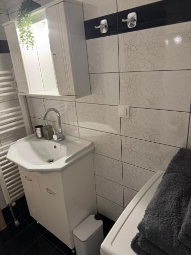 a bathroom with a sink and a toilet at My Home in Alexandroupoli