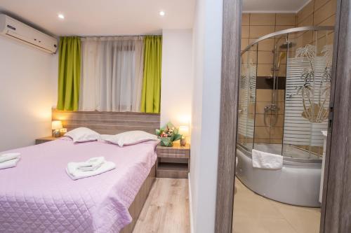 Koupelna v ubytování Hotel Liad City Center