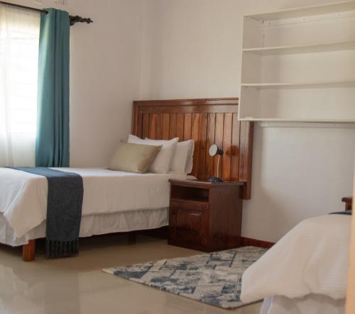 Ένα ή περισσότερα κρεβάτια σε δωμάτιο στο Lynn Holiday Inn