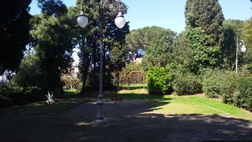 a street light in the middle of a park at La Dolce Casetta in Grottaferrata