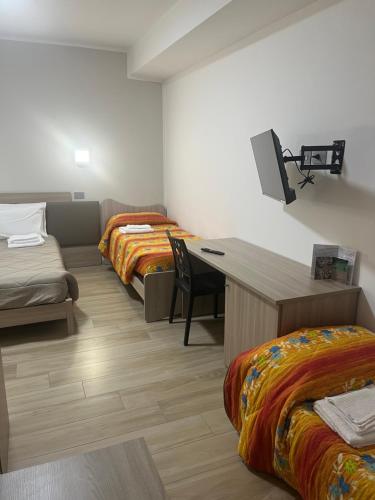Postel nebo postele na pokoji v ubytování B&B La Terrazza Polifrone