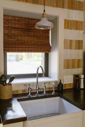 a kitchen with a sink and a window at The Bend Micro Resort in Phoenicia
