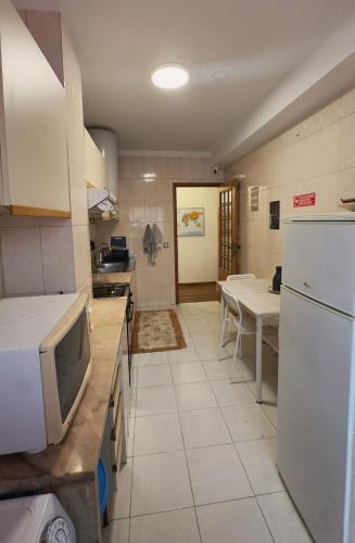 Кухня или мини-кухня в Guest House Da Mata

