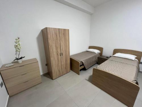 Postel nebo postele na pokoji v ubytování B&B La Terrazza Polifrone