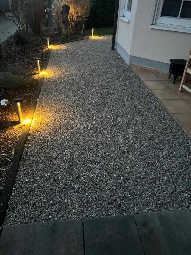 a garden with lights on the side of a house at Villa Ferres in Piesport