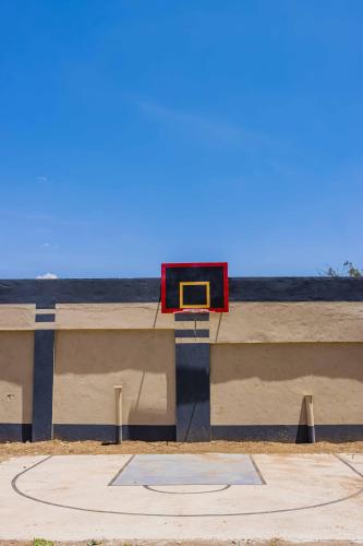 a basketball hoop on top of a concrete wall at Urban suites 2 bedroom Master ensuite holiday rental nanyuki in Nanyuki