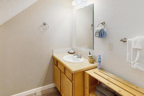 a bathroom with a sink and a mirror at The Beach Barn in Netarts