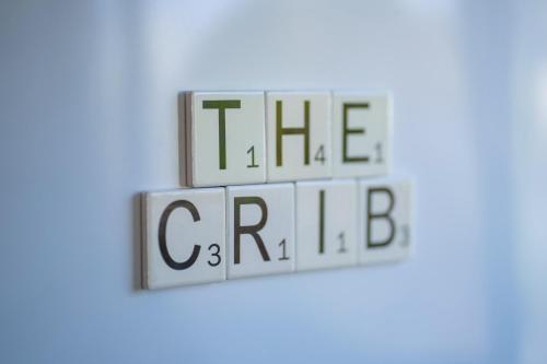 a group of cubes with the words the game on them at The Crib Haven - Te Anau Holiday Home in Te Anau
