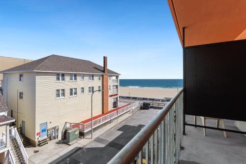 a view of the beach from the balcony of a condo at Americana Motor Inn on Boardwalk in Ocean City