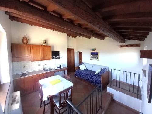 a living room with a couch and a table at Antico Borgo Carceri & Wellness in Bevagna