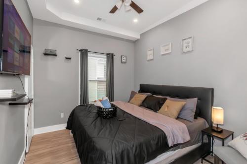 a bedroom with a large bed in a room at Chic 4BR Home Near AUC&DTWN Attractions in Atlanta