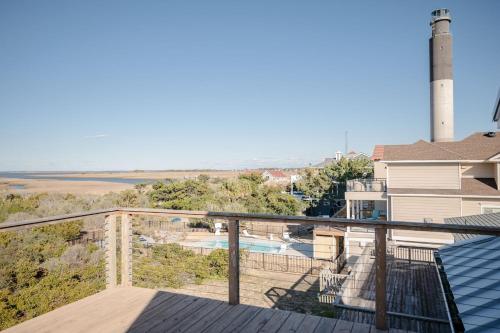 a view from the balcony of a house with a pool at Lily's Pad in Oak Island