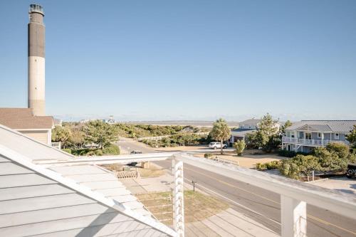 a view from the balcony of a house with a lighthouse at Lily's Pad in Oak Island