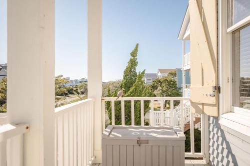 a balcony with a view of the ocean from a house at Lily's Pad in Oak Island