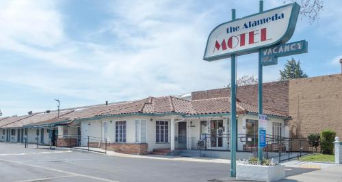a motel sign in front of a building at Alameda Motel San Jose in San Jose