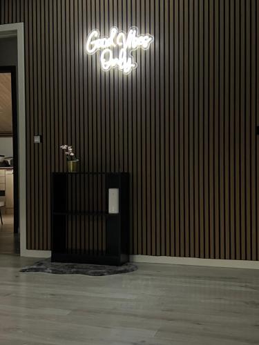 a room with a chandelier on the wall at GoodVibe House Billund by KIRIJA in Billund