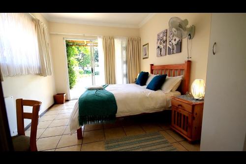 Un ou plusieurs lits dans un hébergement de l'établissement Dove's Nest Guest House