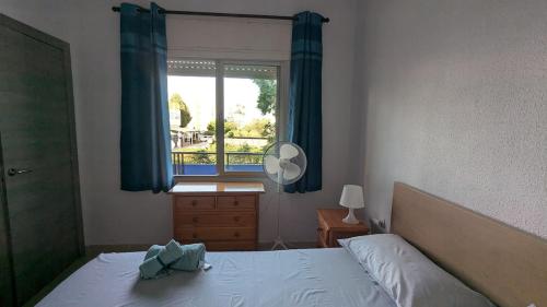 En eller flere senge i et værelse på Apartamento en Torremolinos, Los Alamos