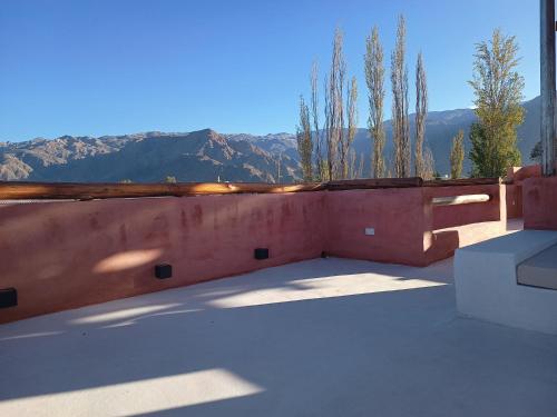 a balcony with a view of the mountains at WAYTAY in Cafayate