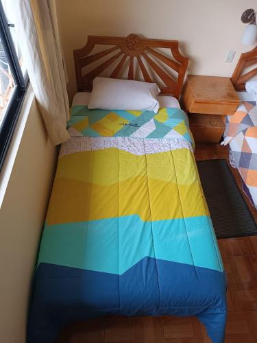 Postel nebo postele na pokoji v ubytování Hostal Your Home