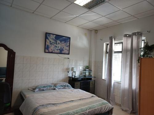 Ένα ή περισσότερα κρεβάτια σε δωμάτιο στο Stay in Sintra - Mem Martins