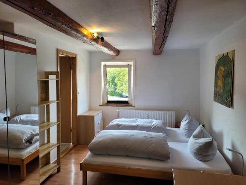 a bedroom with two beds and a window at Göttingen-Boarding in Göttingen