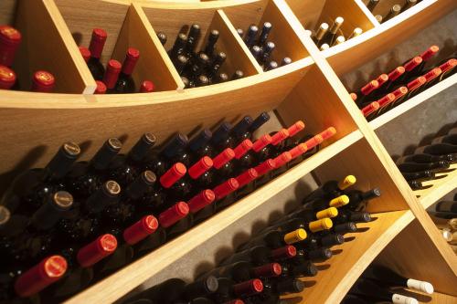 a wine cellar with many bottles of wine at Donna Carmela Resort & Lodges in Riposto