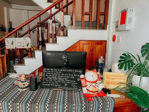 a table with a laptop computer on top of it at Oriana Dalat in Da Lat