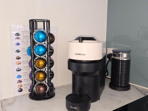 a coffee maker and a blender on a counter at Peaceful On Pembroke in Stratford