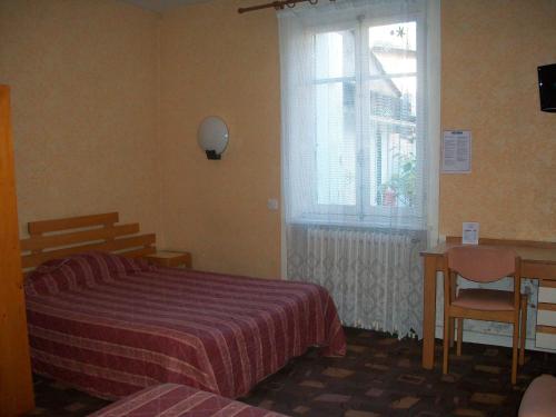 Postel nebo postele na pokoji v ubytování Hotel L'Aiglon