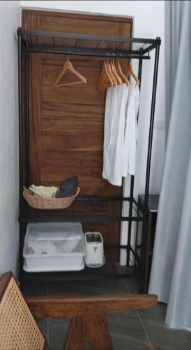 a room with a closet with a shelf with towels at Tanouy Garden in Baan Khai