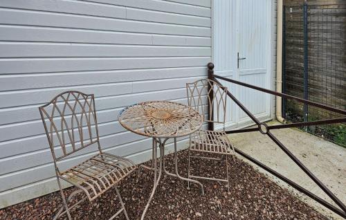 two chairs and a table on a patio at Awesome Home In Milly-Sur-Thérain in Milly-sur-Thérain