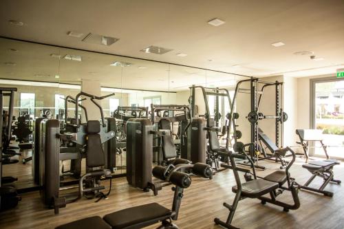 a gym with a bunch of tread machines in it at Domaine de Verchant & Spa - Relais & Châteaux in Montpellier